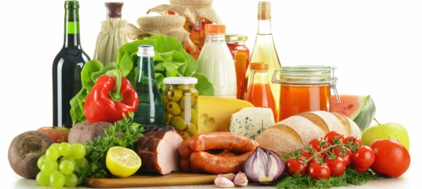 Composition with variety of grocery products including vegetables, fruits, meat, dairy and wine