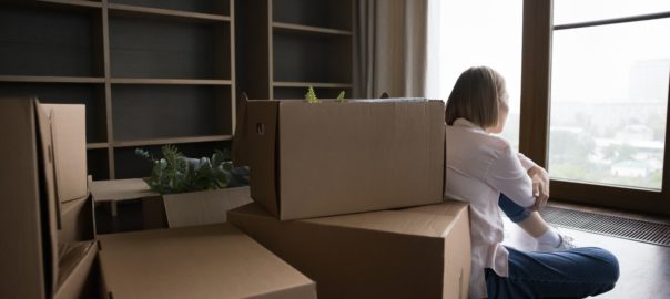 Rear,Back,View,Young,Woman,Sit,On,Floor,Near,Heap